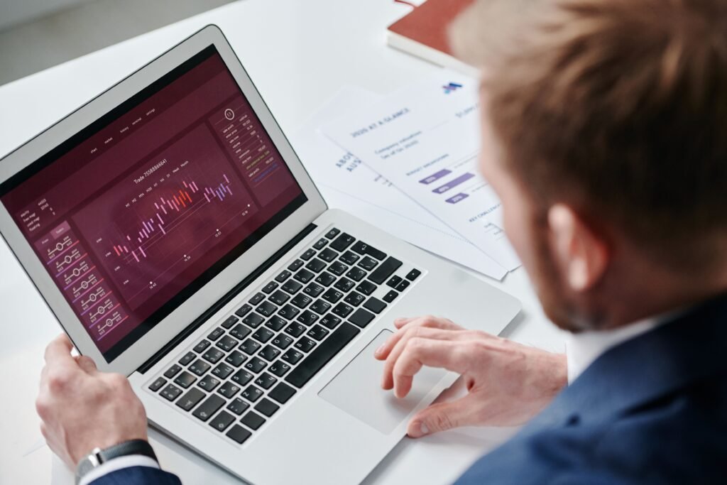 Reviewing a performance report and charts on a laptop