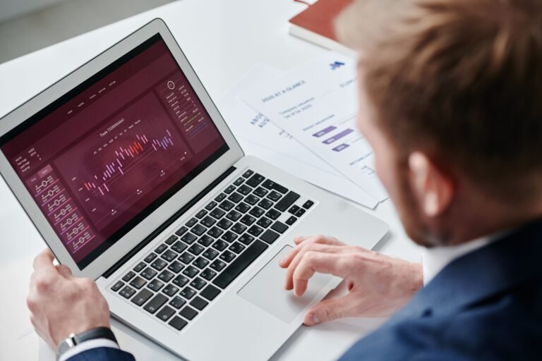 Reviewing a performance report and charts on a laptop